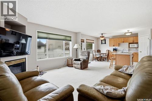 1204 Boehm Bay N, Regina, SK - Indoor Photo Showing Living Room With Fireplace