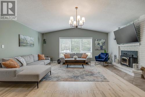 50 Leonard Road, Tiny, ON - Indoor Photo Showing Living Room With Fireplace
