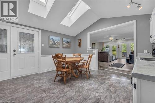 Vaulted ceiling dining area with skylights and wood-finish flooring - 270 Erie Boulevard, Long Point, ON - Indoor Photo Showing Dining Room