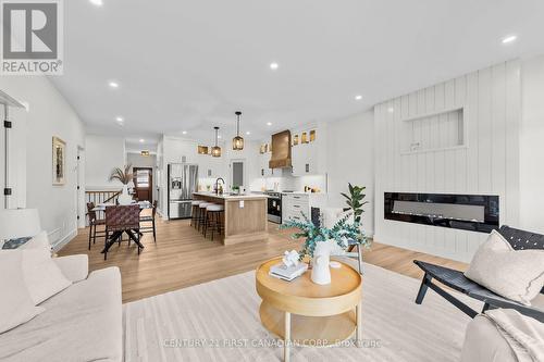 134 Addison Avenue, Lucan Biddulph (Lucan), ON - Indoor Photo Showing Living Room With Fireplace