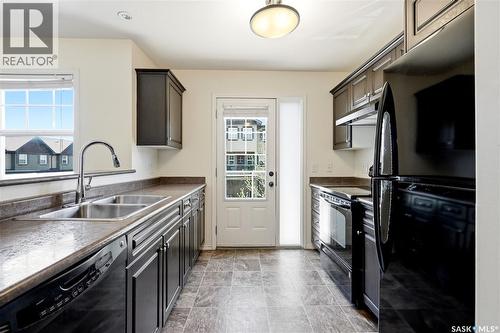 570 150 Langlois Way, Saskatoon, SK - Indoor Photo Showing Kitchen With Double Sink