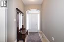 Foyer with glass side lights for natural light featuring an arched transom and sidelight windows, and tile floors - 565 Springwater Drive, Waterloo, ON  - Indoor Photo Showing Other Room 