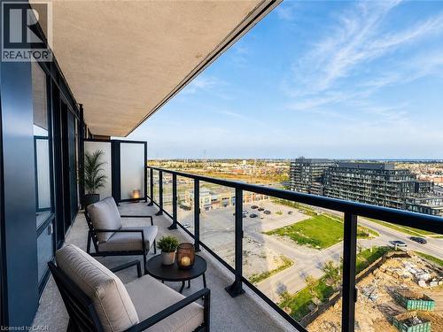 Private concrete balcony with a glass and metal railing system - 4878 Powers Common Unit# C-1108, Burlington, ON - Outdoor With Balcony With View With Exterior