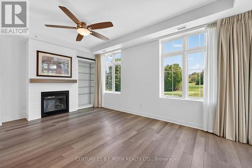 310 - 40 Horseshoe Boulevard, Oro-Medonte, ON - Indoor Photo Showing Living Room With Fireplace