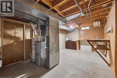Unfinished basement featuring exposed wood joists and concrete flooring - 1862 Briarwood Drive, Cambridge, ON - Indoor Photo Showing Basement