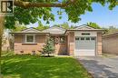 Brick ranch-style exterior with a gabled roofline and attached single-car garage - 1862 Briarwood Drive, Cambridge, ON  - Outdoor 