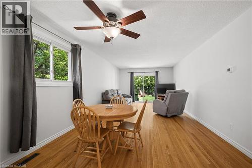Bright interior space featuring wood-finish flooring and a ceiling fan with integrated lighting - 1862 Briarwood Drive, Cambridge, ON - Indoor Photo Showing Dining Room