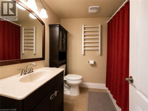 Bathroom featuring a dark wood vanity with a light-colored countertop and integrated sink - 917 Orpha Street, Burlington, ON - Indoor Photo Showing Bathroom