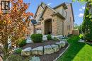 Brick facade residence featuring an arched entryway, gabled rooflines, and a two-car garage. - 828 Copper Ridge Drive, Waterloo, ON  - Outdoor With Facade 