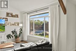 Main living space overlooks backyard oasis - 