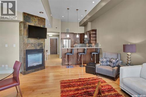 314 1132 College Drive, Saskatoon, SK - Indoor Photo Showing Living Room With Fireplace