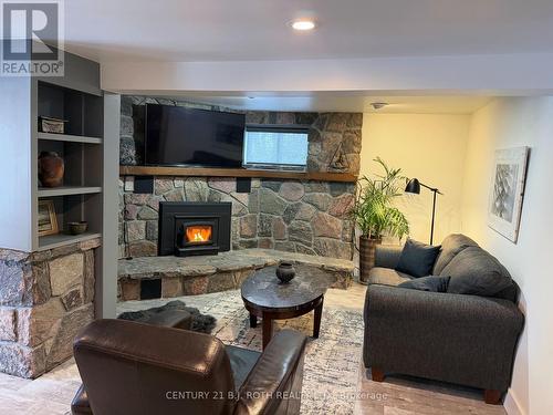 Stone Fireplace - 8101 Kings River Road, Ramara, ON - Indoor Photo Showing Living Room With Fireplace