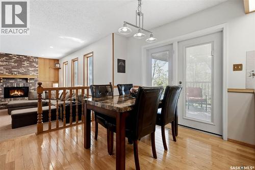 2447 Swayze Crescent, Regina, SK - Indoor Photo Showing Dining Room With Fireplace