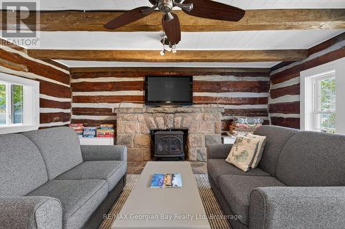 83 Beach Road, Tiny, ON - Indoor Photo Showing Living Room With Fireplace