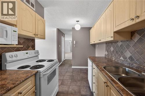 700 Dynes Road Unit# 101, Burlington, ON - Indoor Photo Showing Kitchen With Double Sink