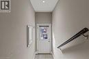 Rear exterior door with frosted glass window and blind, featuring a recessed ceiling light - 181 West Avenue N Unit# 4, Hamilton, ON  - Indoor Photo Showing Other Room 