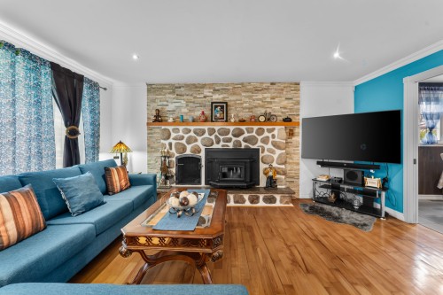 Salon - 226 Rue Houde, Saint-Eustache, QC - Indoor Photo Showing Living Room With Fireplace