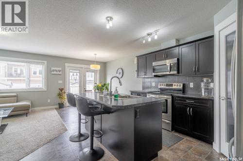 4510 Green Poplar Lane E, Regina, SK - Indoor Photo Showing Kitchen With Stainless Steel Kitchen With Upgraded Kitchen