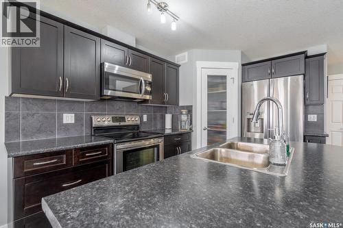 4510 Green Poplar Lane E, Regina, SK - Indoor Photo Showing Kitchen With Stainless Steel Kitchen With Double Sink With Upgraded Kitchen