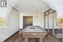 Recreational room featuring wood-finish flooring and recessed lighting - 