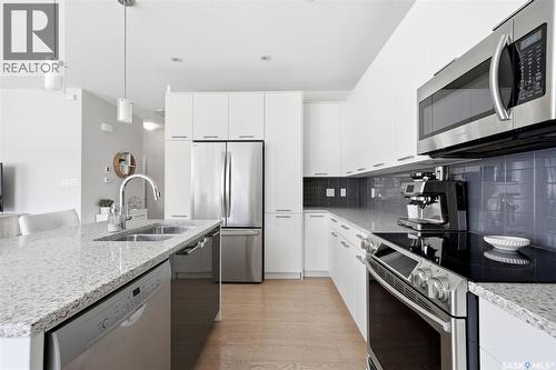 4929 Green Brooks Way E, Regina, SK - Indoor Photo Showing Kitchen With Double Sink With Upgraded Kitchen