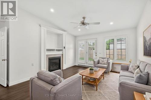 Virtually Staged - 18 Devon Drive, South Huron (Exeter), ON - Indoor Photo Showing Living Room With Fireplace