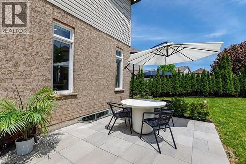 Patio area featuring light-toned paver stones - 916 Steepleridge Court, Kitchener, ON - Outdoor