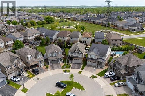 Aerial perspective showcasing a residential cul-de-sac with multiple two-story homes - 916 Steepleridge Court, Kitchener, ON - Outdoor With View