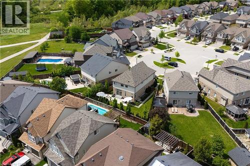 Aerial view of a residential neighborhood with diverse roofing styles, including asphalt shingles and light-colored siding - 916 Steepleridge Court, Kitchener, ON - Outdoor With View