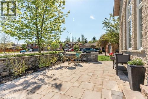 Stone paver patio featuring a stone retaining wall with plantings - 12 Buman Court, Barrie, ON - Outdoor