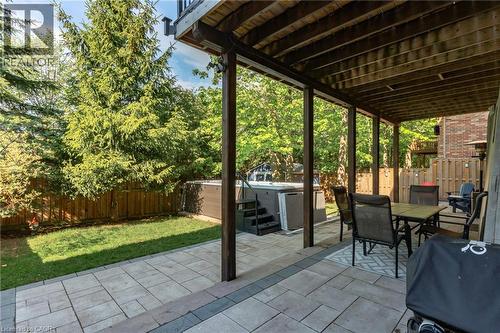 Expansive paver patio with a covered outdoor living area and swimming spa - 12 Buman Court, Barrie, ON - Outdoor With Deck Patio Veranda