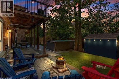 Brick exterior featuring a two-story deck with string lighting - 12 Buman Court, Barrie, ON - Outdoor With Deck Patio Veranda