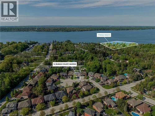 Aerial perspective showcasing a residential area with mature trees and a substantial body of water - 12 Buman Court, Barrie, ON - Outdoor With Body Of Water With View