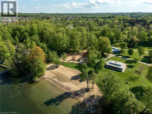Steps to Tyndale Beach featuring a sandy beach area, playgrounds, lush green spaces, mature trees, and a nearby residential area. - 12 Buman Court, Barrie, ON - Outdoor With View