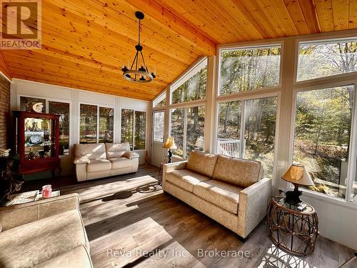 Sunroom with walkout to deck - 11 Ridge Road, Bancroft (Bancroft Ward), ON - Indoor Photo Showing Living Room
