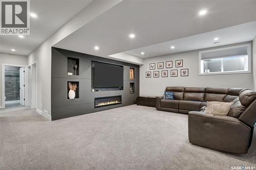 2 437 Palmer Crescent, Warman, SK - Indoor With Fireplace