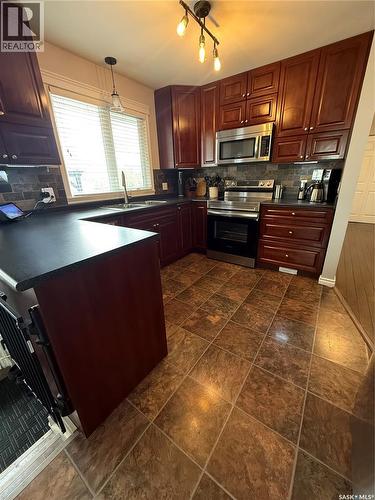 1920 Dyer Road, Estevan, SK - Indoor Photo Showing Kitchen With Double Sink
