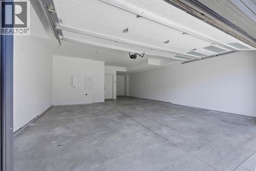 7599 Klinger Road Unit# 18, Okanagan Landing, BC - Indoor Photo Showing Garage