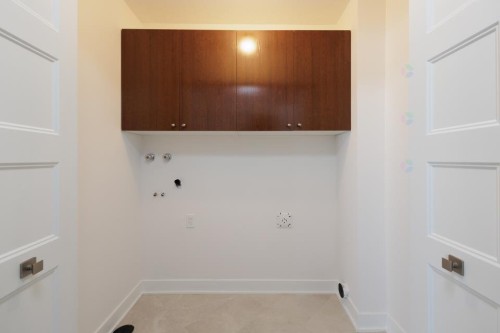 Laundry - 103-2515 Rue Dutrisac, Vaudreuil-Dorion, QC - Indoor Photo Showing Other Room