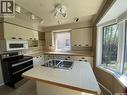 210 First Avenue, Yorkton, SK  - Indoor Photo Showing Kitchen With Double Sink 