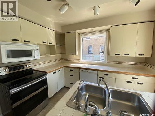 210 First Avenue, Yorkton, SK - Indoor Photo Showing Kitchen With Double Sink