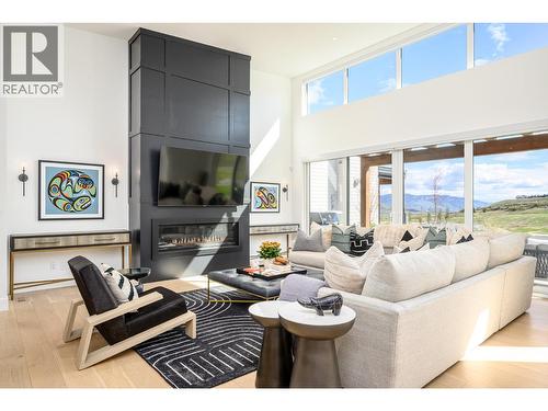 105 Predator Ridge Drive Unit# 21, Vernon, BC - Indoor Photo Showing Living Room With Fireplace
