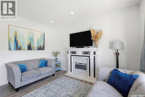 335 Hassard Close, Saskatoon, SK - Indoor Photo Showing Living Room With Fireplace