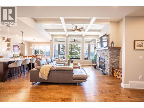 Open space living room/kitchen and dining area - 132 Crown Crescent, Vernon, BC - Indoor Photo Showing Living Room With Fireplace