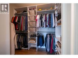 Primary bedroom walk-in closet - 
