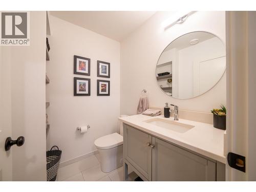 Basement bathroom next to family room - 132 Crown Crescent, Vernon, BC - Indoor Photo Showing Bathroom