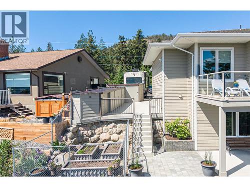 Side of house garden area and stairs to driveway - 132 Crown Crescent, Vernon, BC - Outdoor