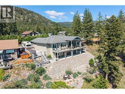 Rear view of the home with terraced , low maintenance  yard - 