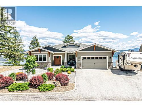 Lots of parking and oversized double garage + 30 AMP RV plug outside - 132 Crown Crescent, Vernon, BC - Outdoor With Facade