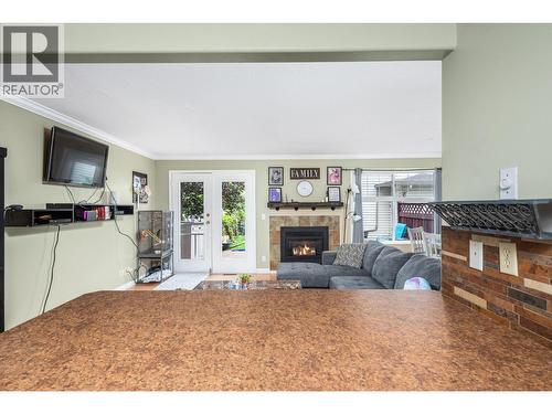 2395 Pleasant Valley Road Unit# 5, Armstrong, BC - Indoor Photo Showing Living Room With Fireplace